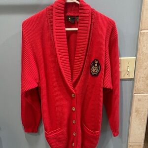Vintage Liz Sport red cotton cardigan with an embroidered crest emblem.